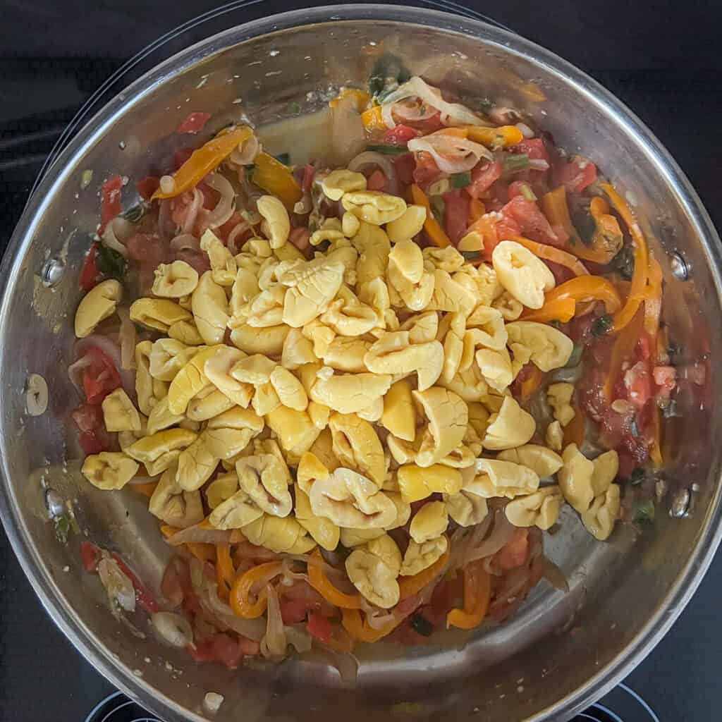 Drained vegan ackee added to the sauté pan with other ingredients.