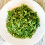 Kale and avocado salad in a bowl.