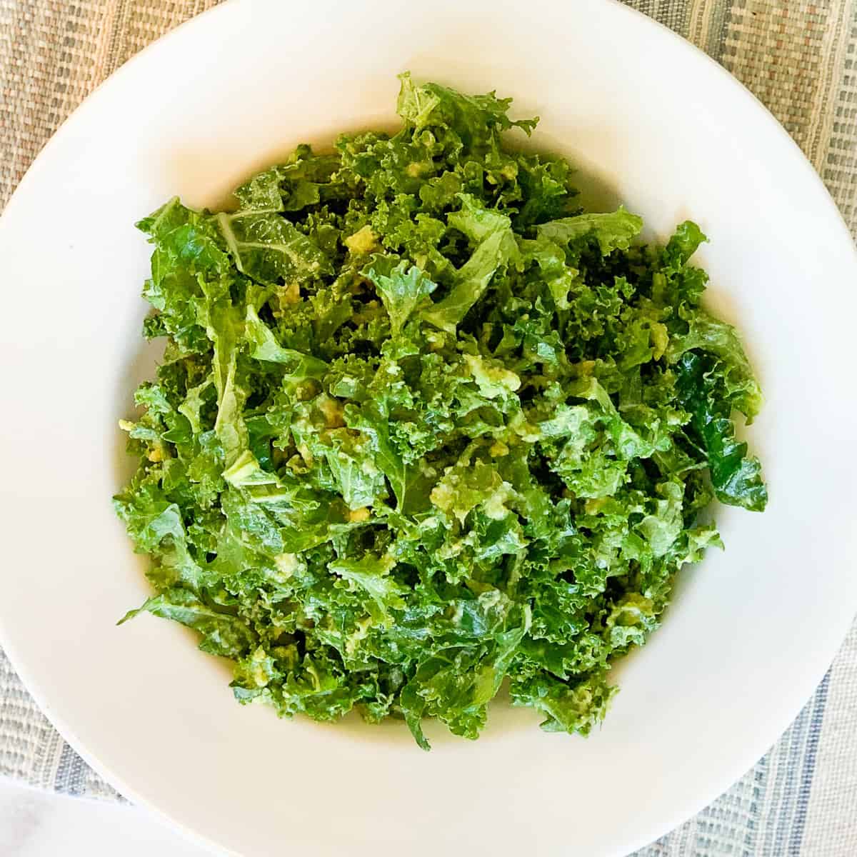 Kale and avocado salad in a bowl.