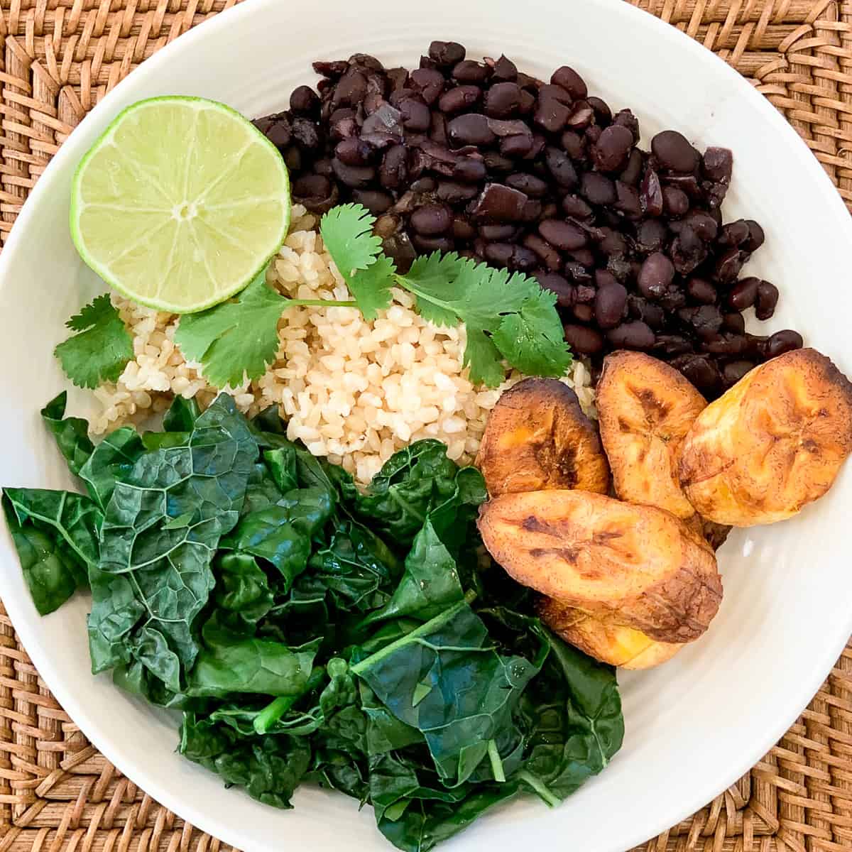 Cuban black beans with brown rice, plantains, steamed kale and fresh lime and cilantro.