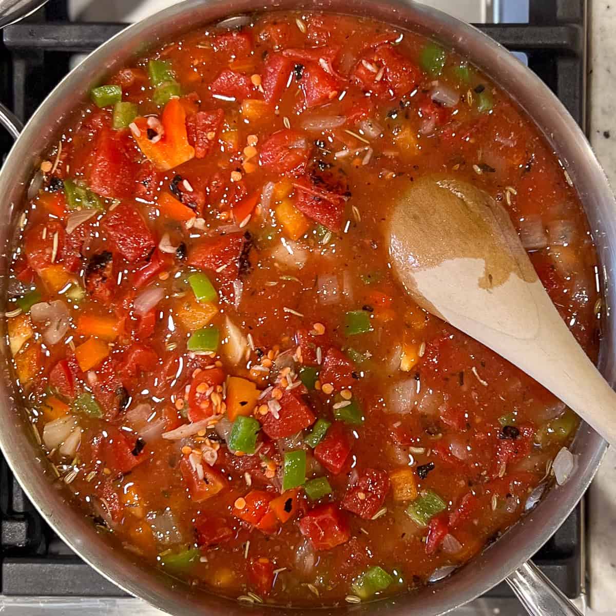 Deconstructed stuffed peppers simmering in the sauté pan.