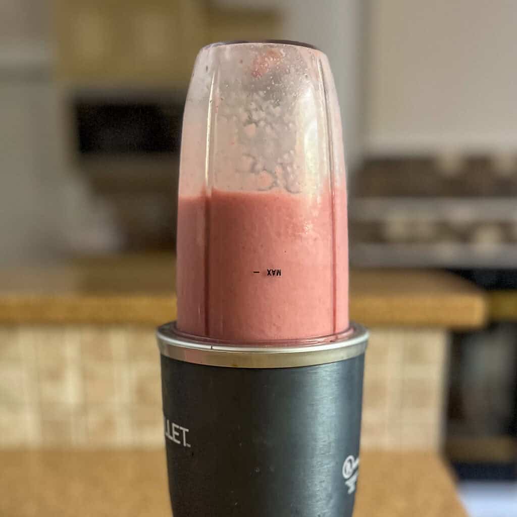 Copycat Starbucks pink drink that has been blended in a mini blender.