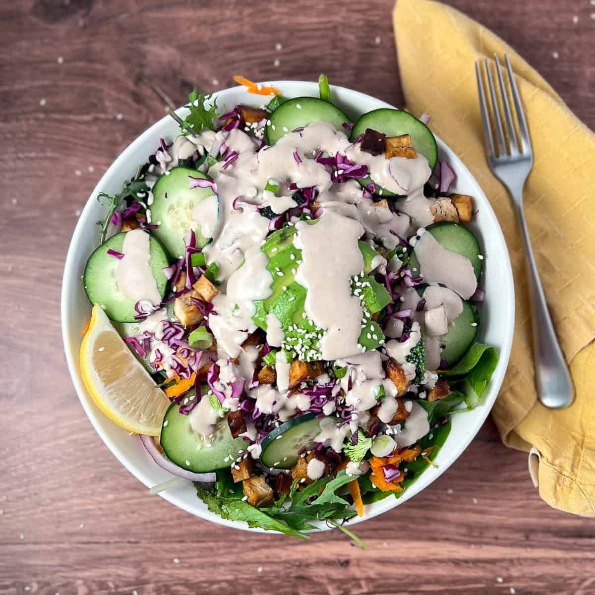 Sushi salad in a bowl with a fork on the side.
