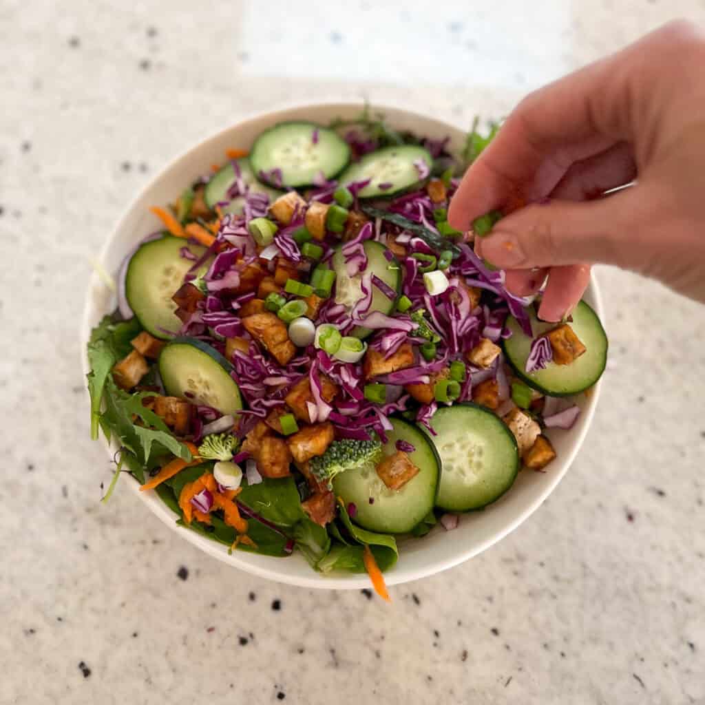 Sushi salad being assembled.