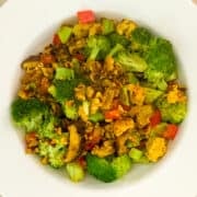 top view close up of veggie tofu scramble in a white rimmed bowl