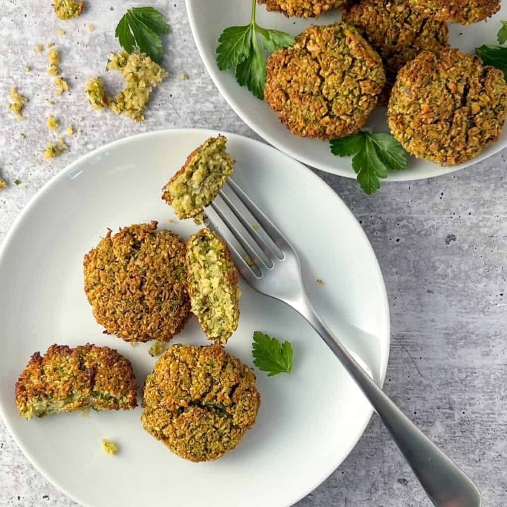 Cooked falafel patties on a plate with fork. 