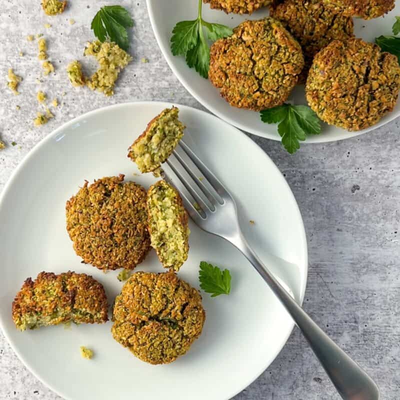 Air fryer falafel on a plate with a fork.