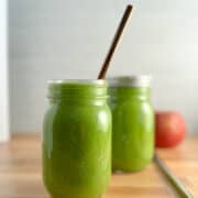 side view of simple 5 ingredient green smoothie in mason jars