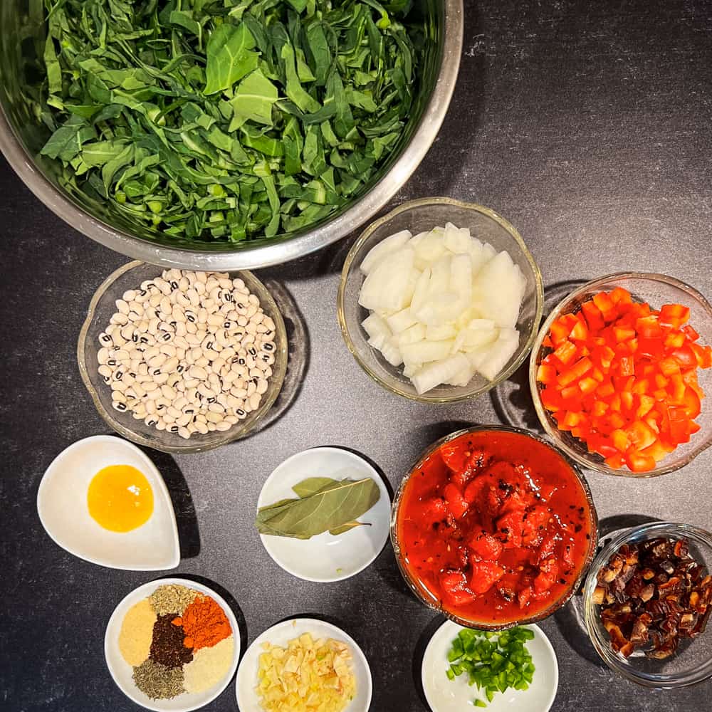 top view of the ingredients to make sweet and smoky black eyed peas and greens