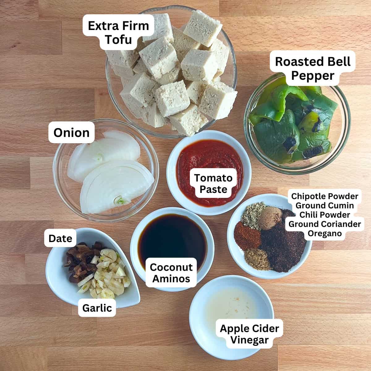 The ingredients for sofritas: tofu, green pepper, onion, tomato paste, spices, garlic, coconut aminos and apple cider vinegar.