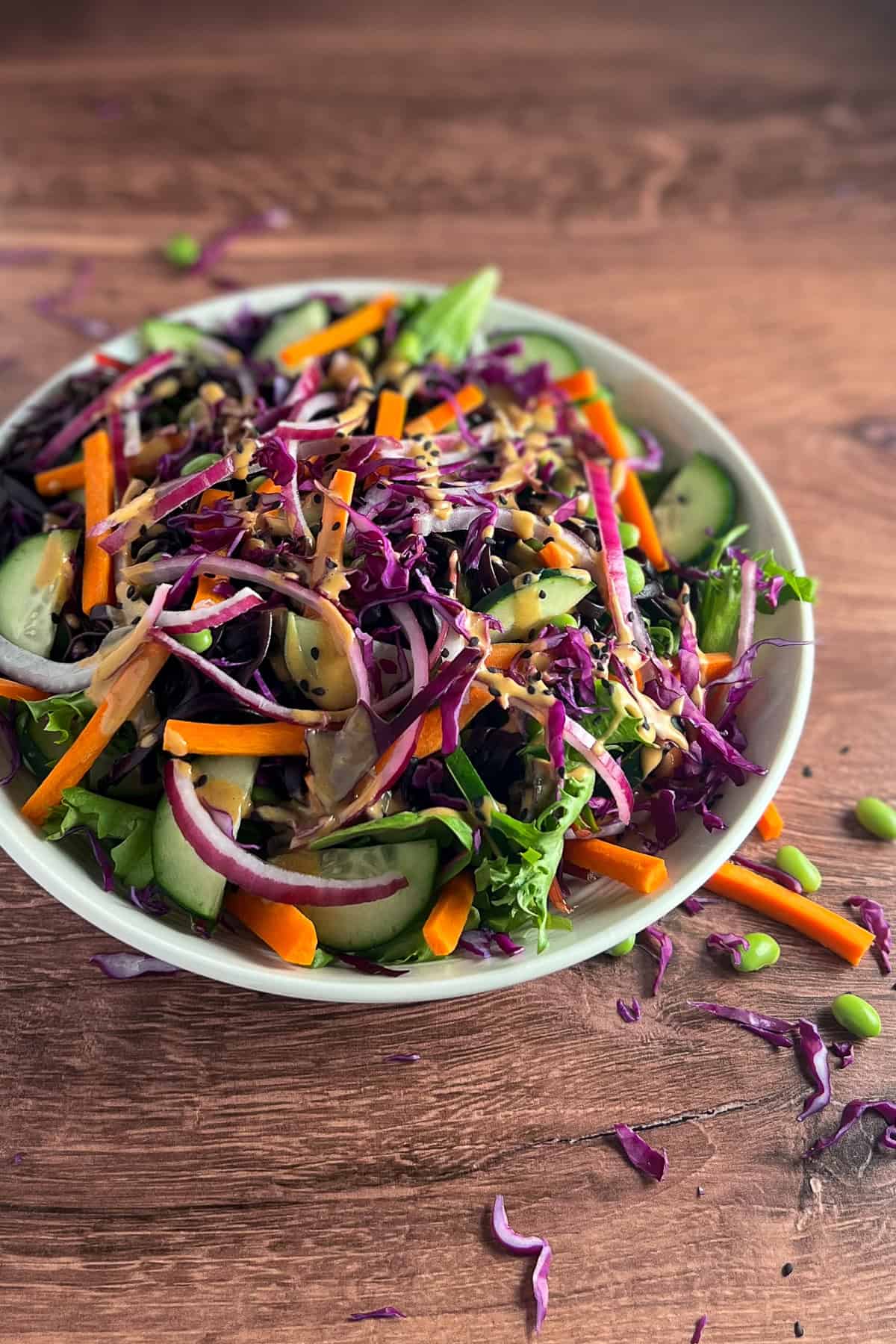 Asian noodle salad with colorful vegetables in a bowl.