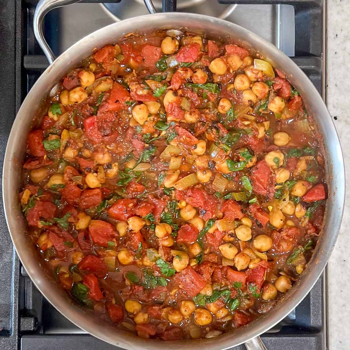 Vegan chana masala in a large sauté pan.