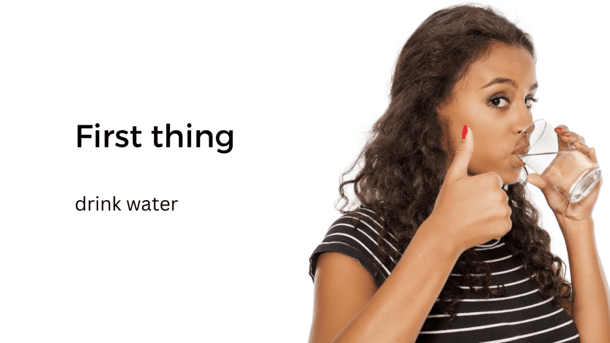 woman drinking water with thumb up
