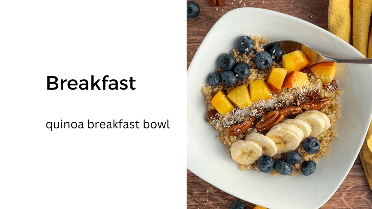 top view close up of quinoa breakfast bowl with fresh fruit and nuts on top