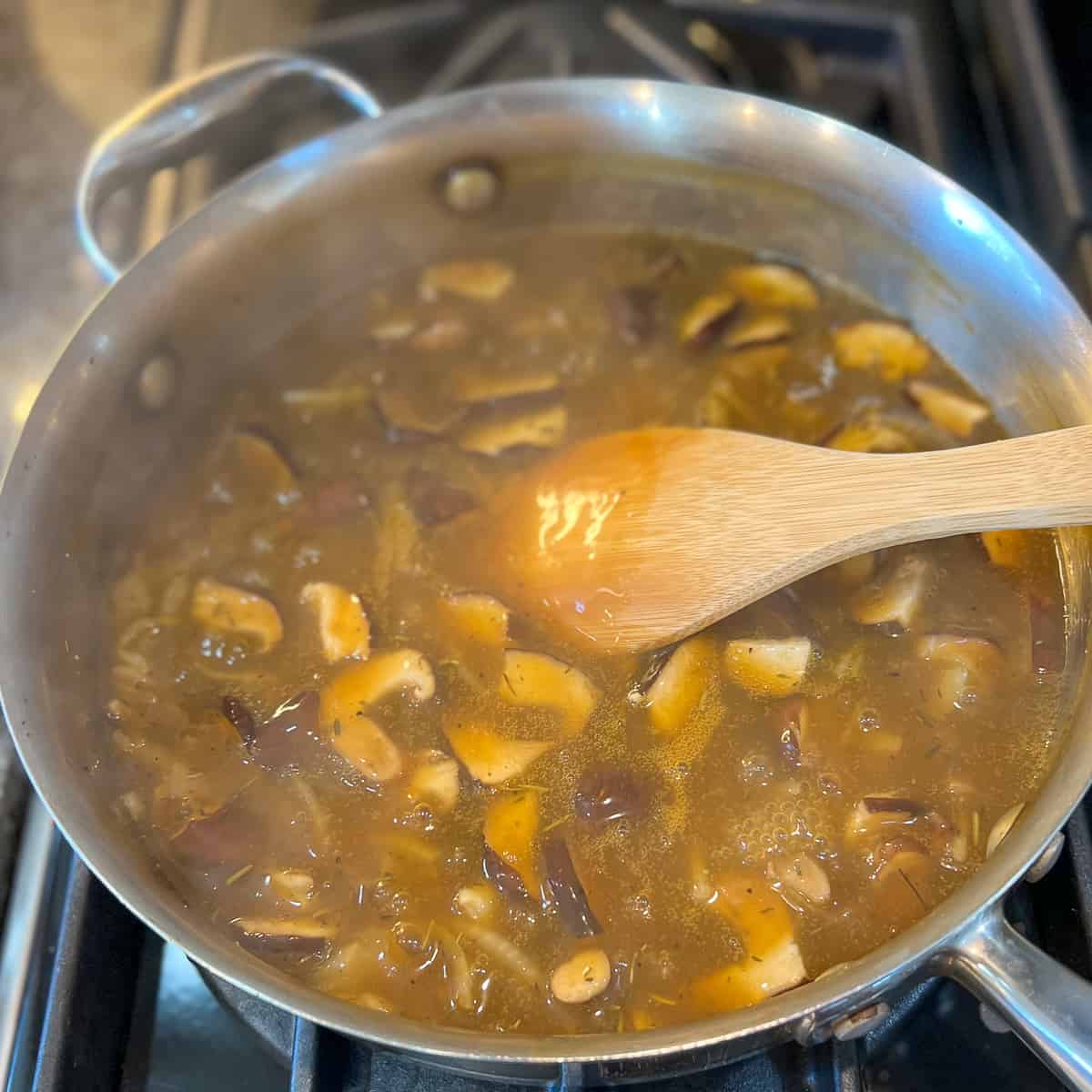 pan with thickened vegan mushroom gravy and steam coming off the top