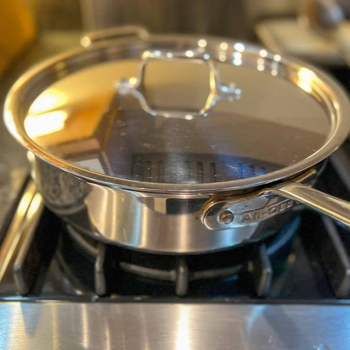 large sauté pan with lid on the stovetop