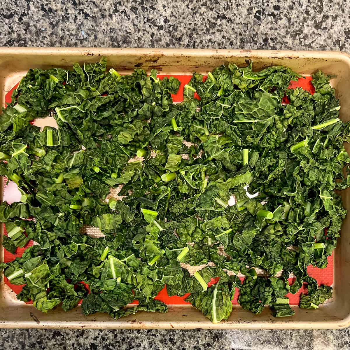 top view of chopped kale on a sheet pan