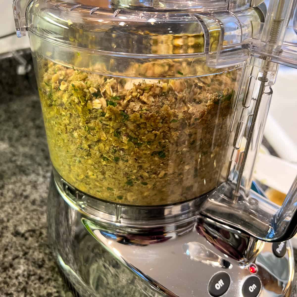Chickpea burger patty mixture being processed in the food processor.