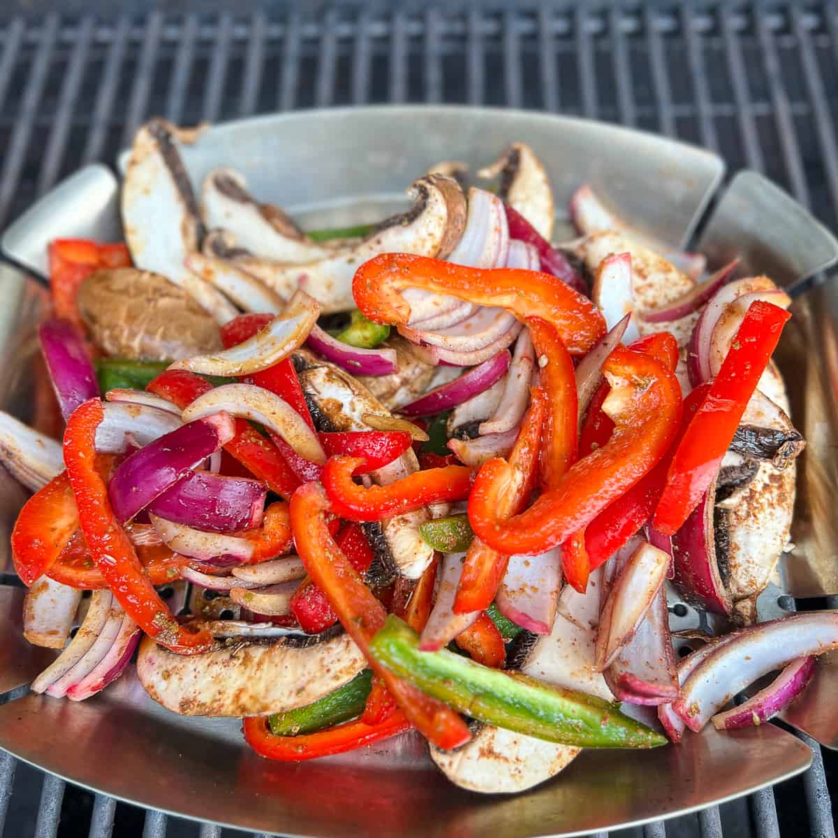 top view of marinated mushrooms and veggies in the hot grill pan