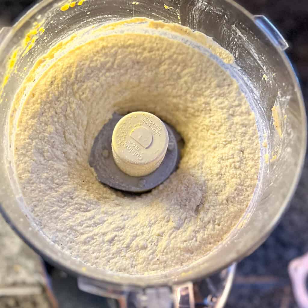 Vegan tofu ricotta that's been processed to a smooth, creamy texture.
