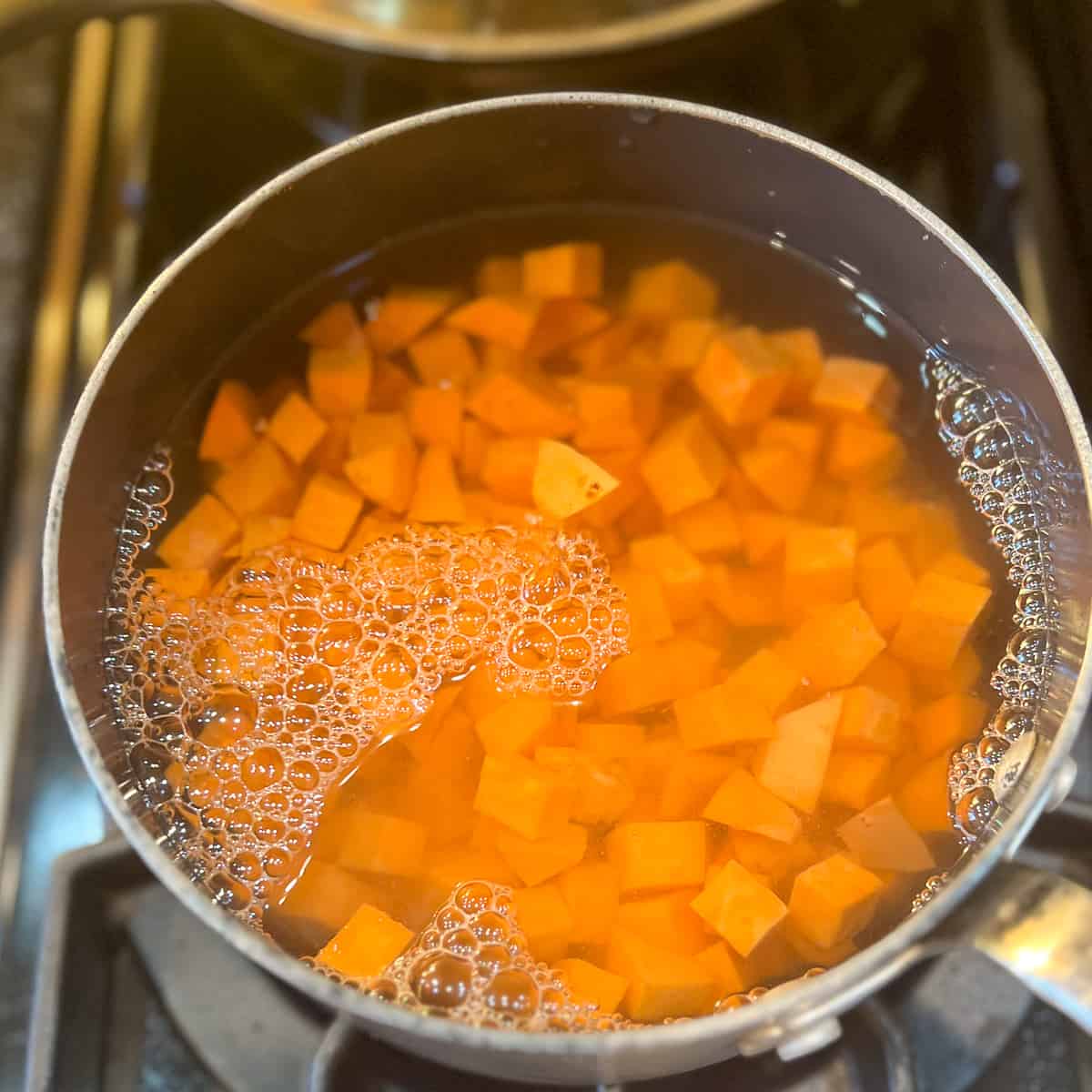 top view of diced sweet potatoes in a pot with water