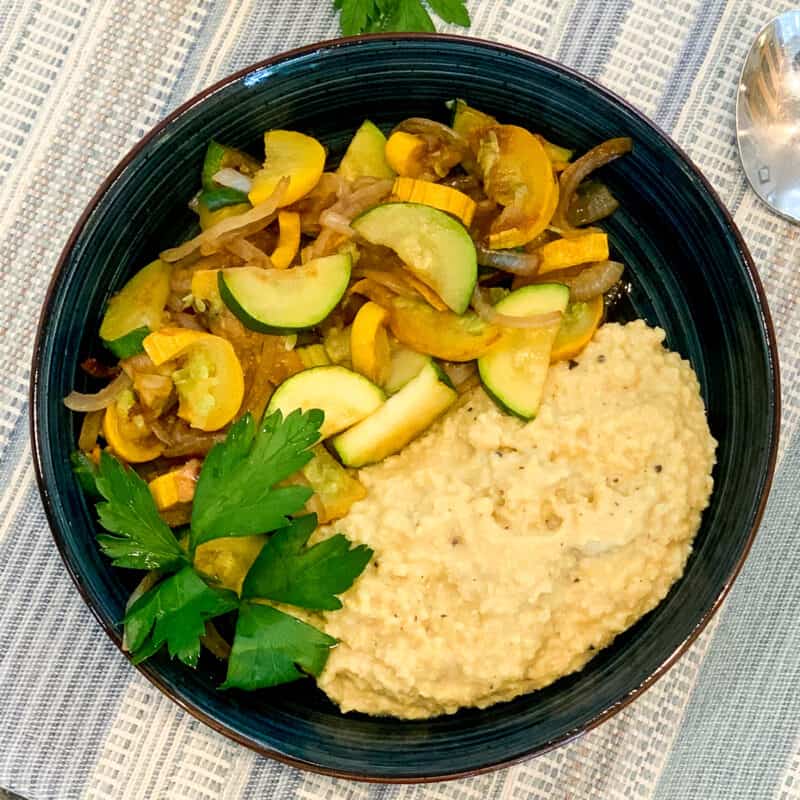 savory millet breakfast bowl with summer squash and fresh herbs