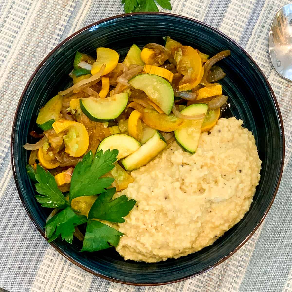 millet in a bowl with summer squash and fresh herbs