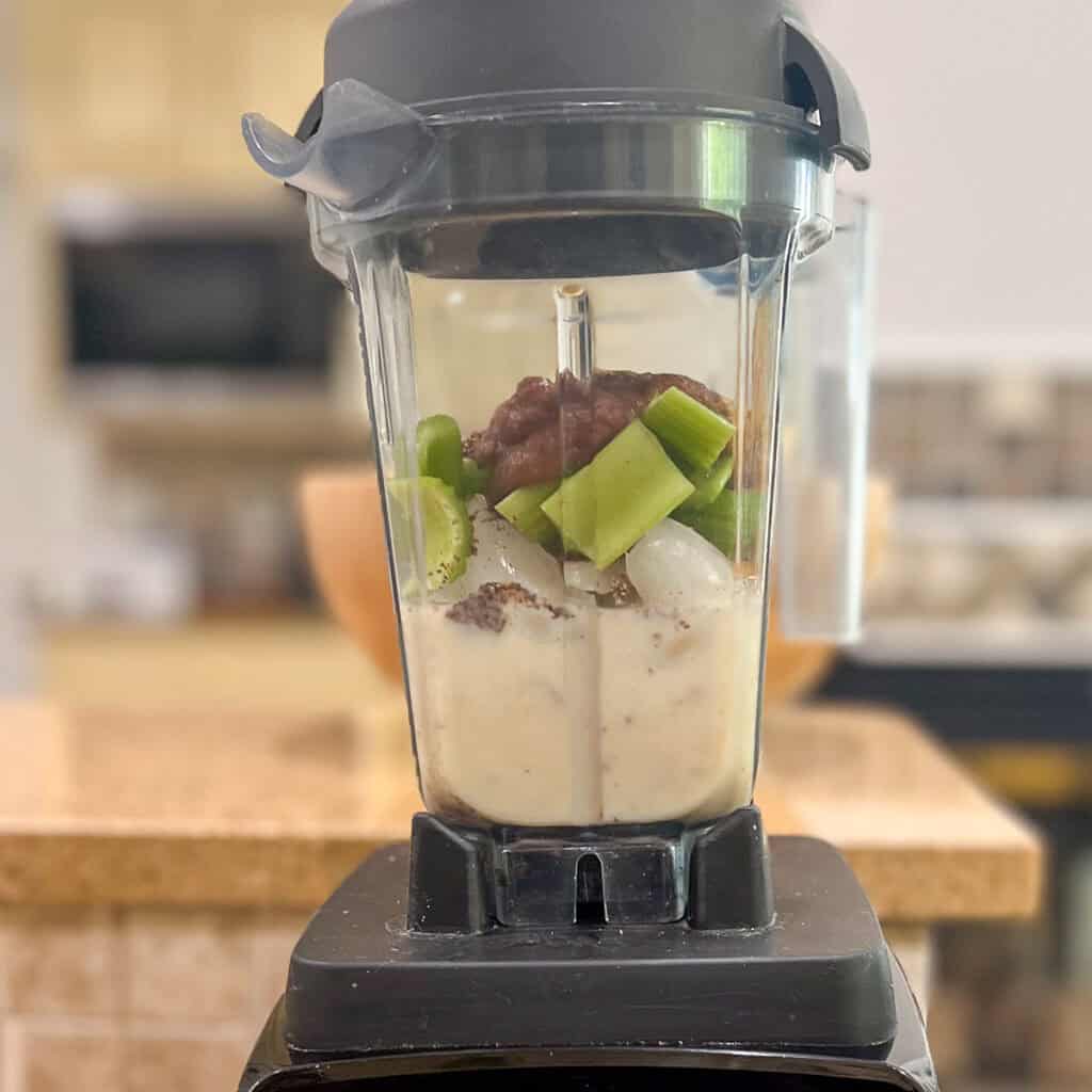 Celery, peanut butter, ground flaxseeds, date syrup and soymilk in a blender.