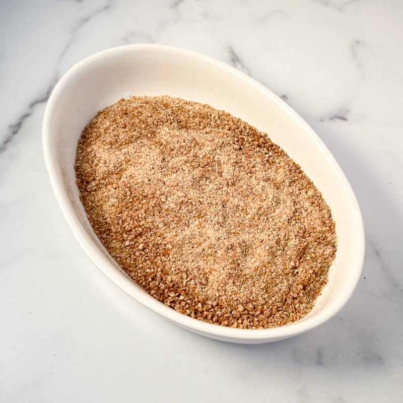 Toasted whole grain bread crumbs in a casserole dish.