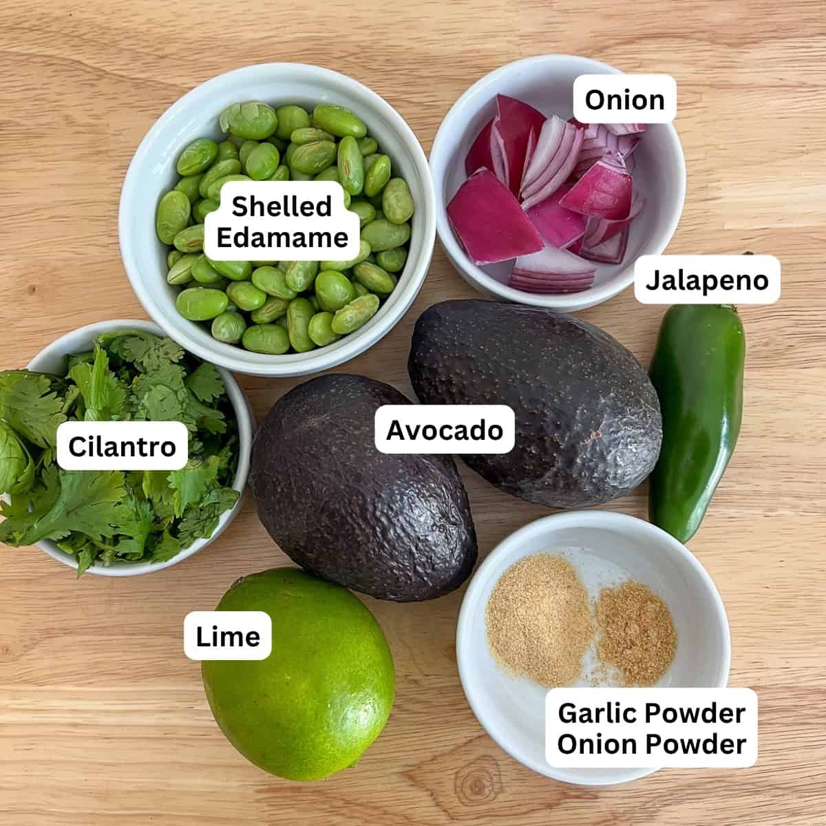Ingredients for edamame hummus: edamame, onion, avocado, cilantro, jalapeno, lime and seasonings.