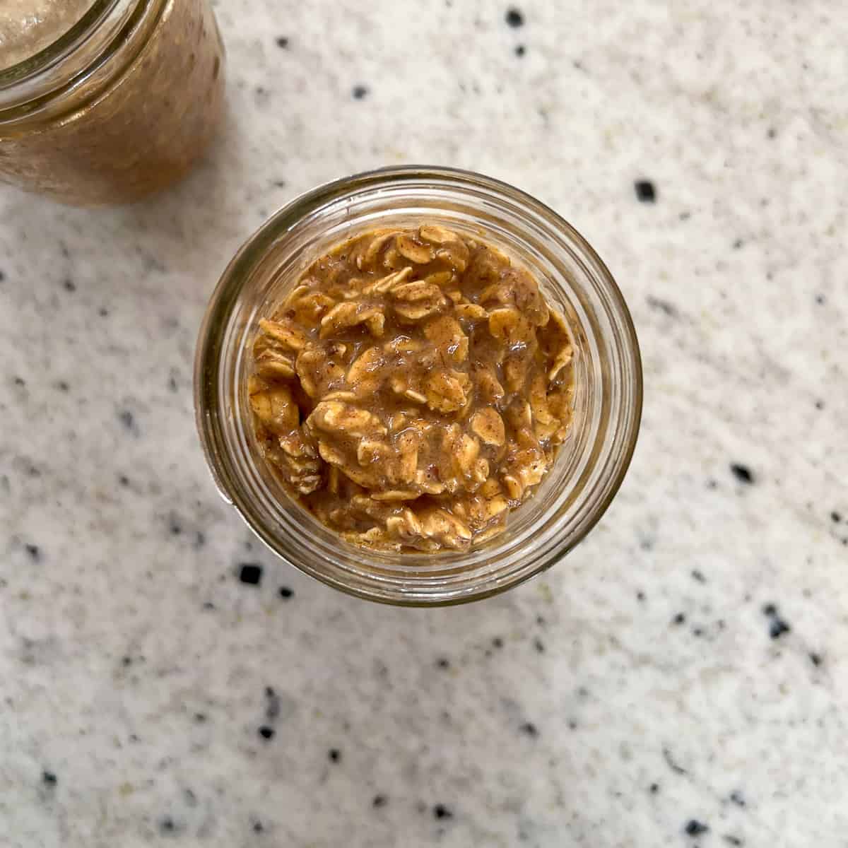 Pumpkin spice overnight oats in a mason jar.