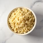 Top view of a bowl of cooked millet.