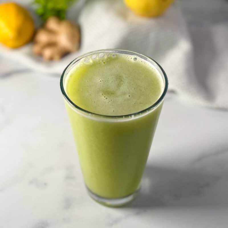 Celery pear ginger juice in a glass.