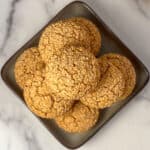 A stack of gluten free vegan cornbread muffins on a plate.