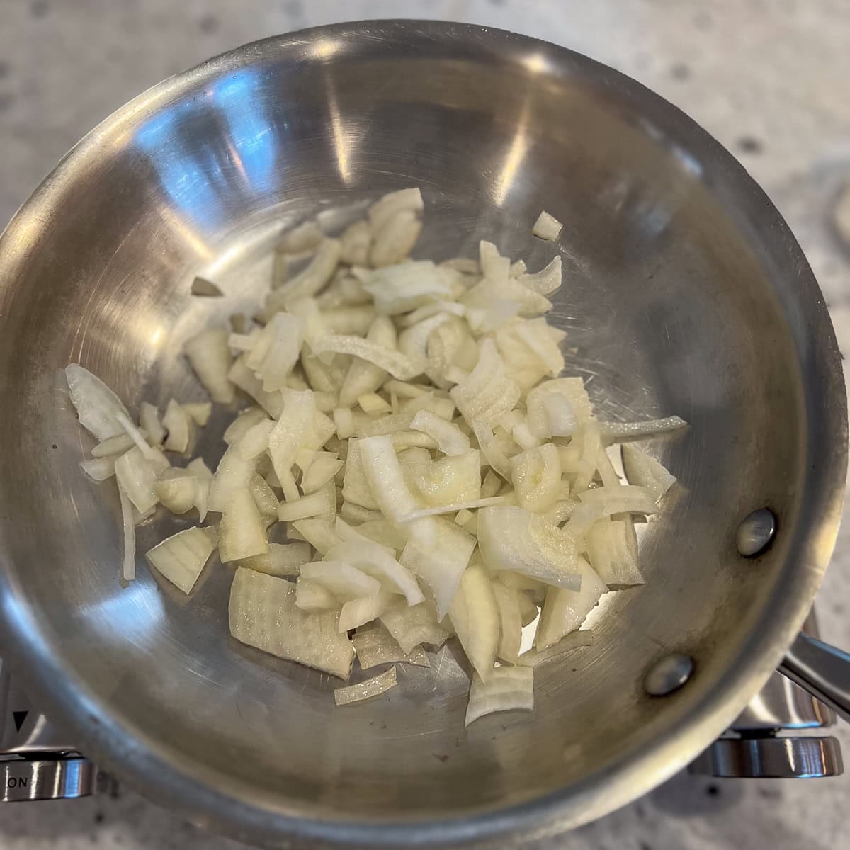 Chopped onions in a skillet.