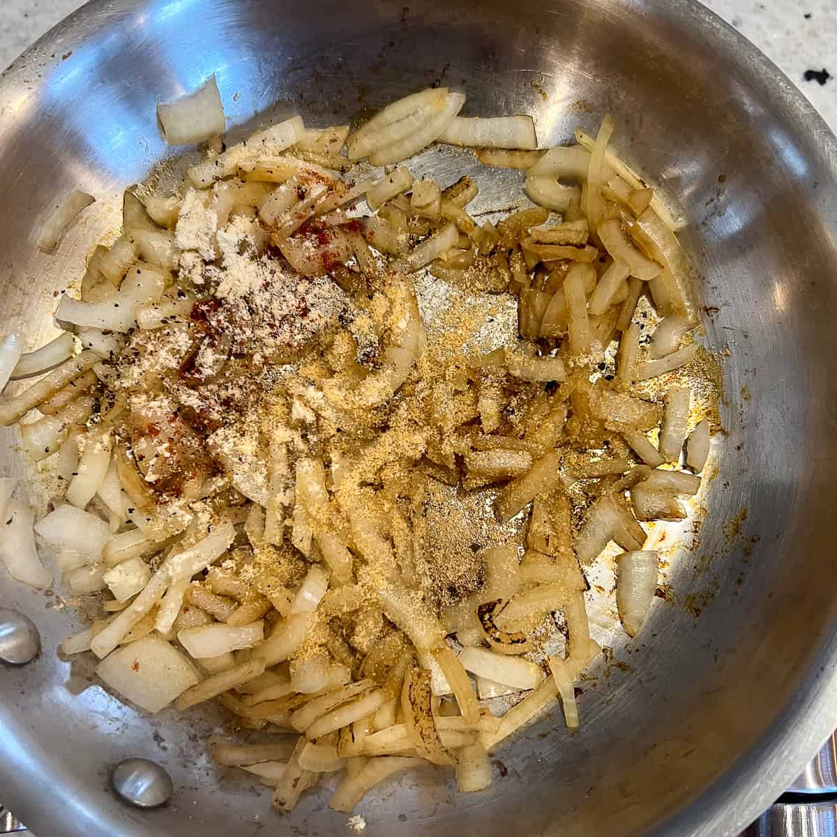 Chopped onions that have been browned and dry spices added.