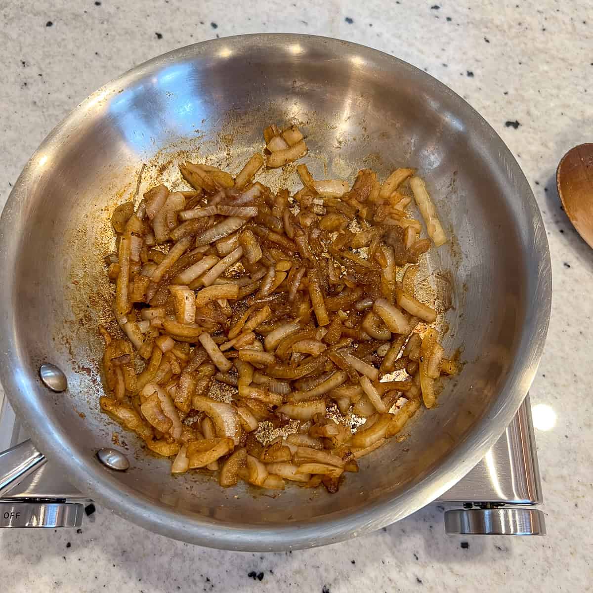 Browned chopped onion and seasonings in the skillet.