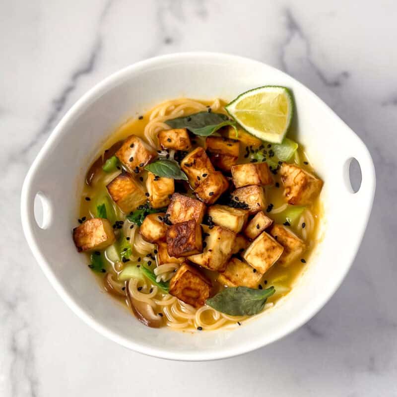 Curry ramen with tofu in a bowl.