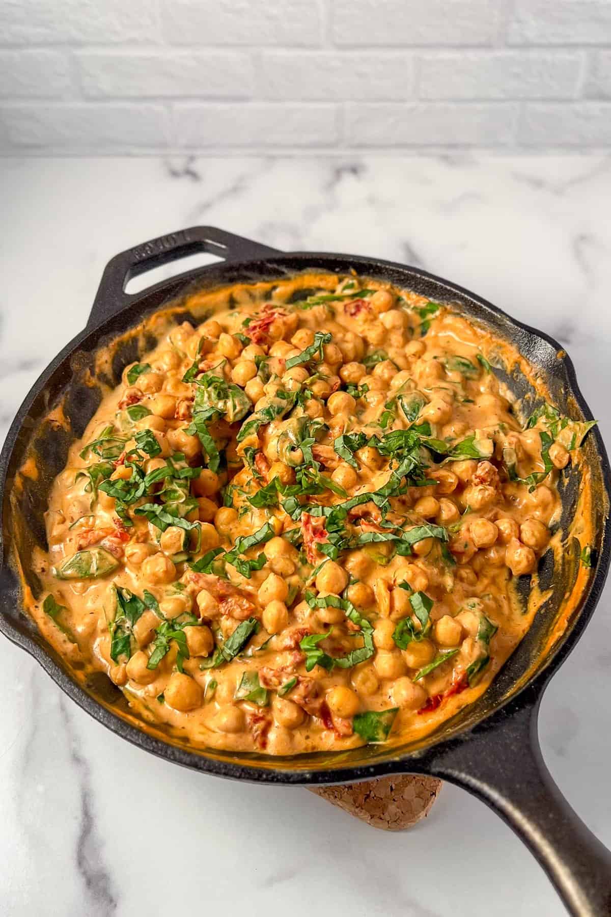 Marry Me Chickpeas in a cast iron skillet.