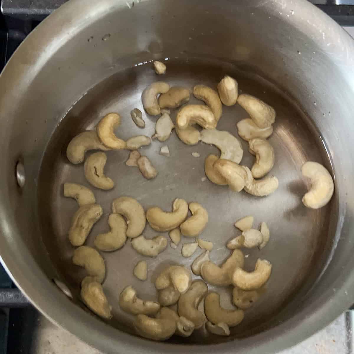 Cashews in a small pot with water for a quick boil to soften them.