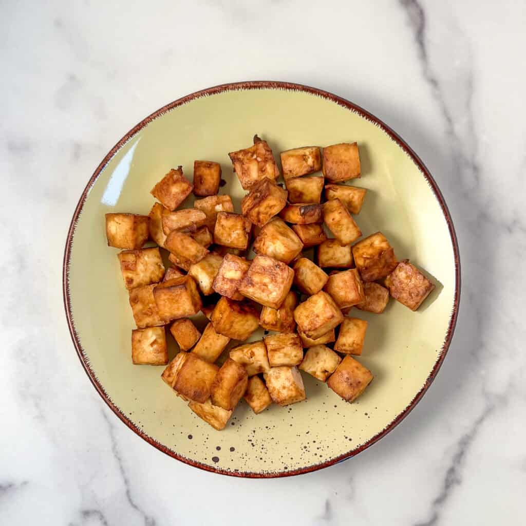 Air fryer tofu nuggets on a plate.