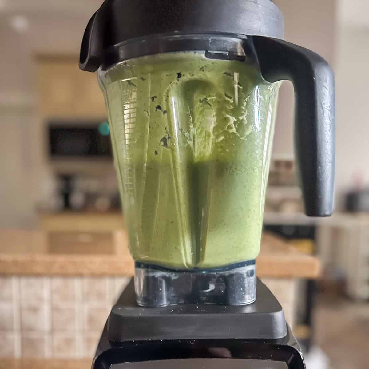 Cucumber gazpacho being blended in a blender.