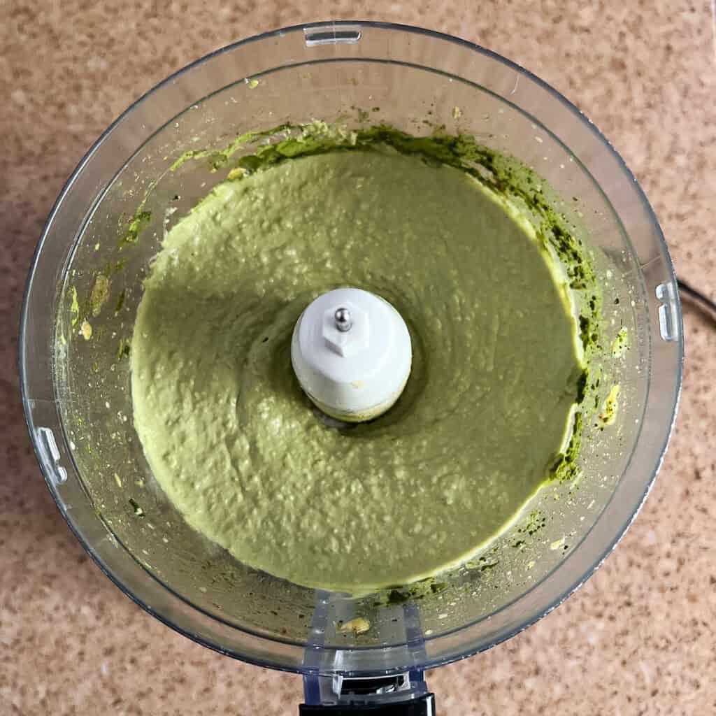 Matcha hummus blended in food processor.