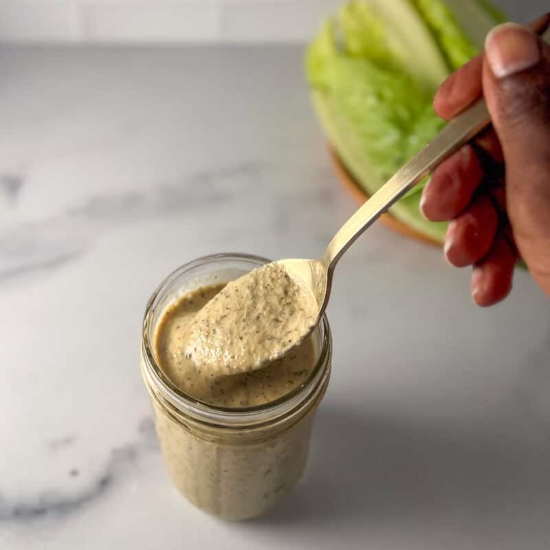 A jar of vegan Caesar dressing.