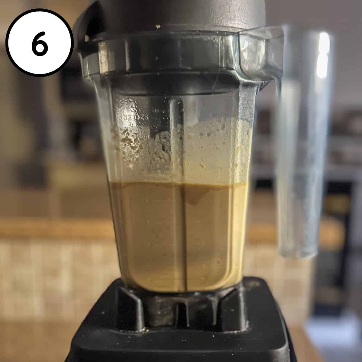 Cashew cream base being blended in a high speed blender.