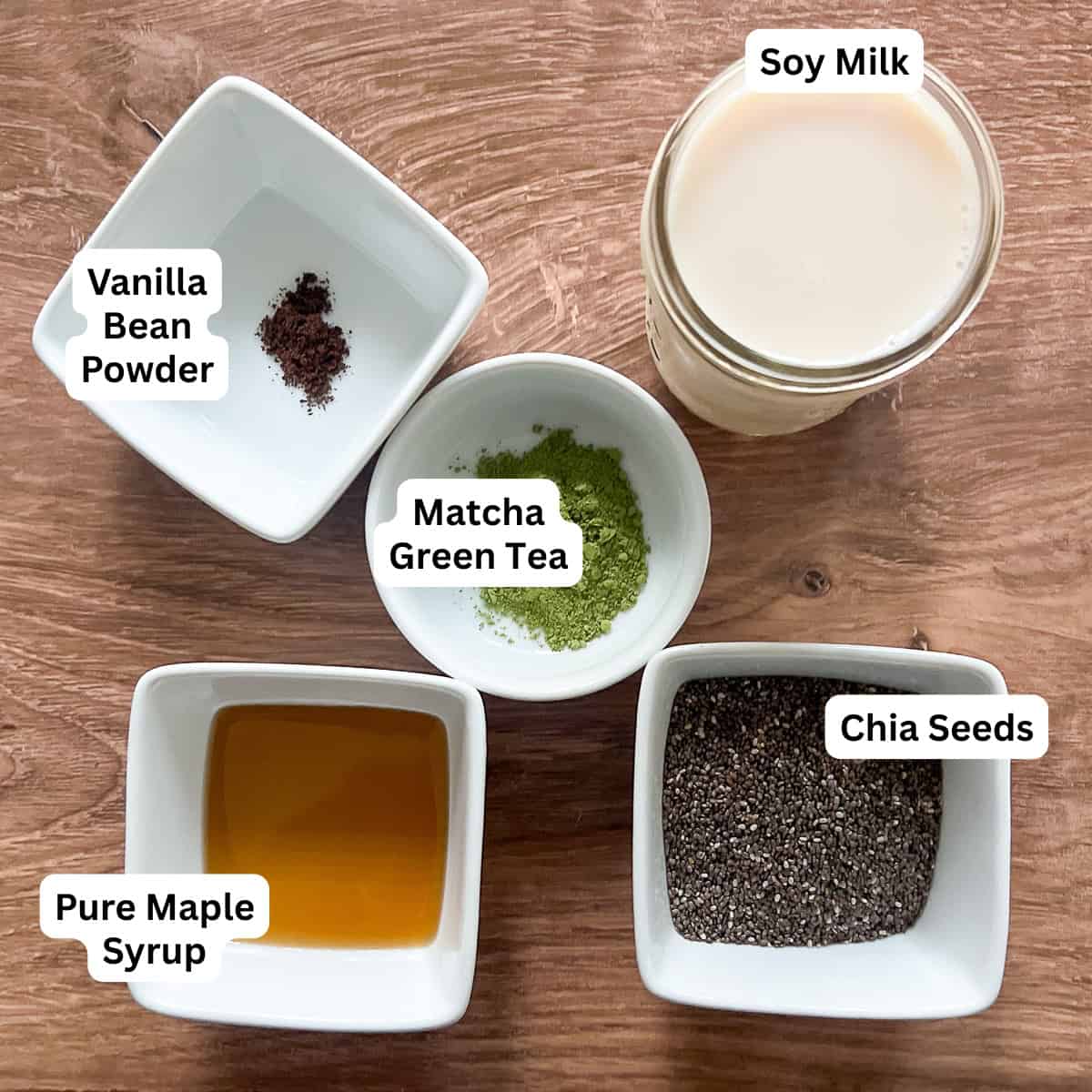 Ingredients for matcha chia pudding: matcha green tea powder, soy milk, maple syrup, vanilla bean powder, and chia seeds.