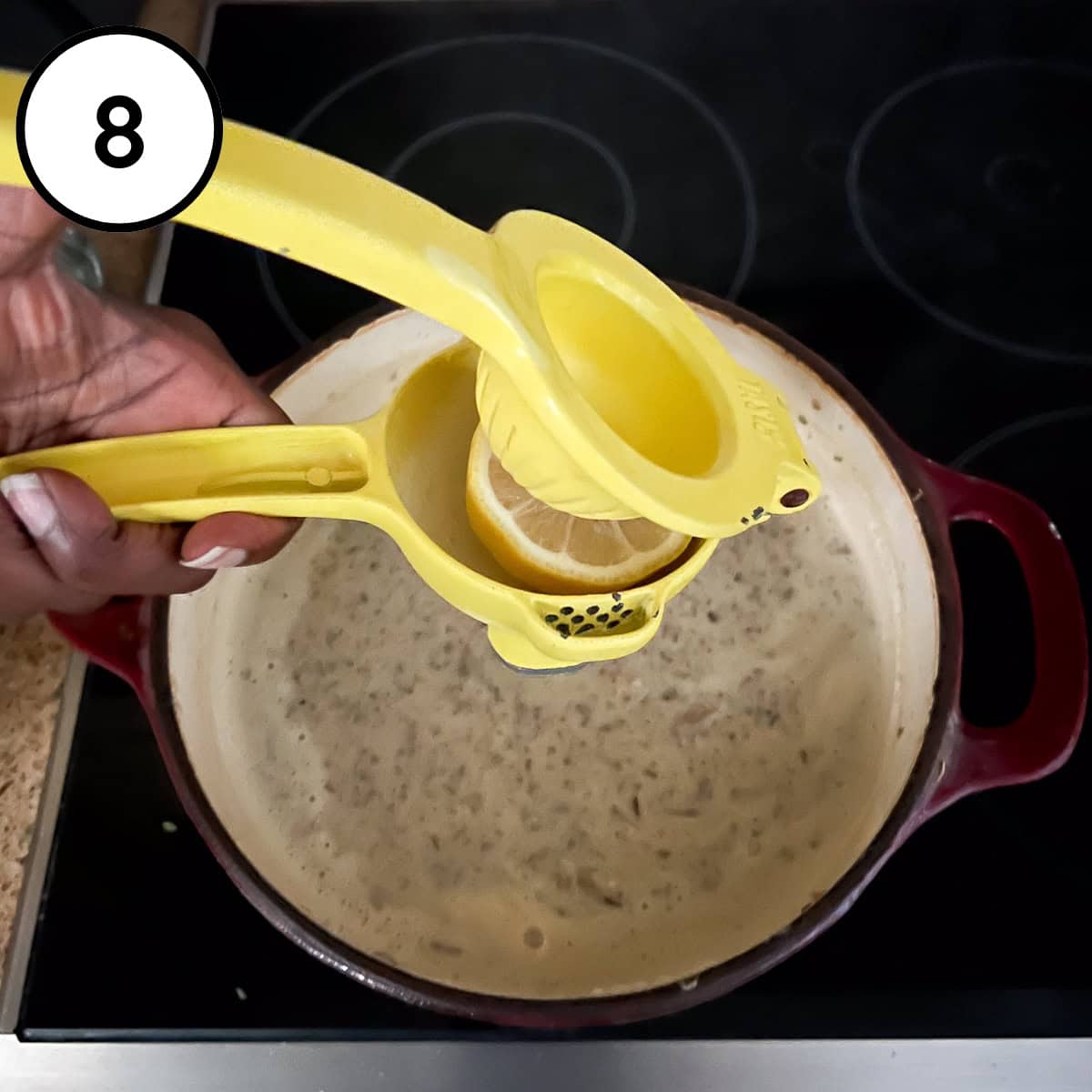 Lemon juice being added to the soup pot.