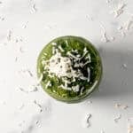 Matcha chia pudding topped with shredded coconut flakes.