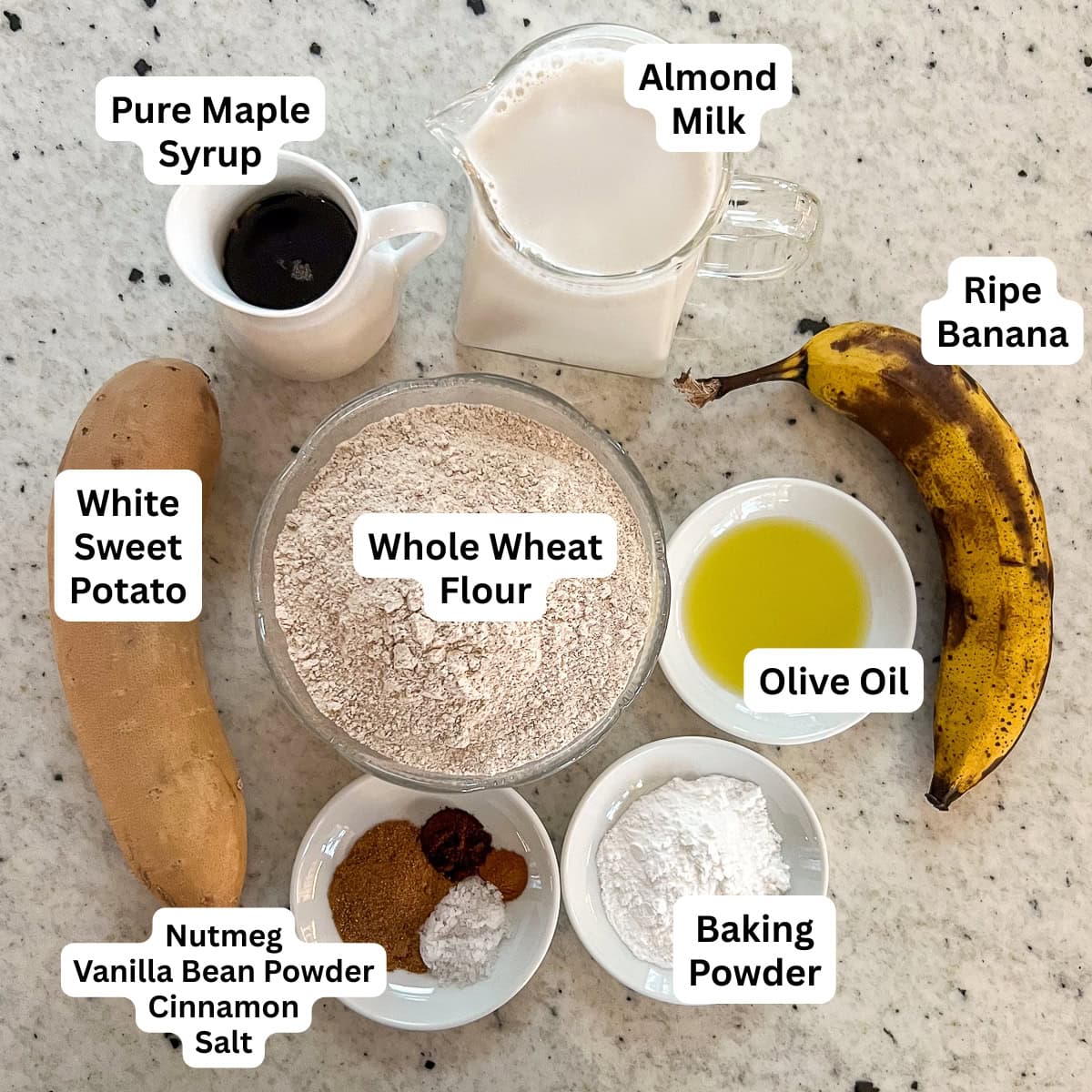Ingredients for vegan eggnog pancakes: whole wheat flour, almond milk, ripe banana, white sweet potato, baking powder, olive oil, nutmeg, cinnamon, vanilla bean powder, salt.