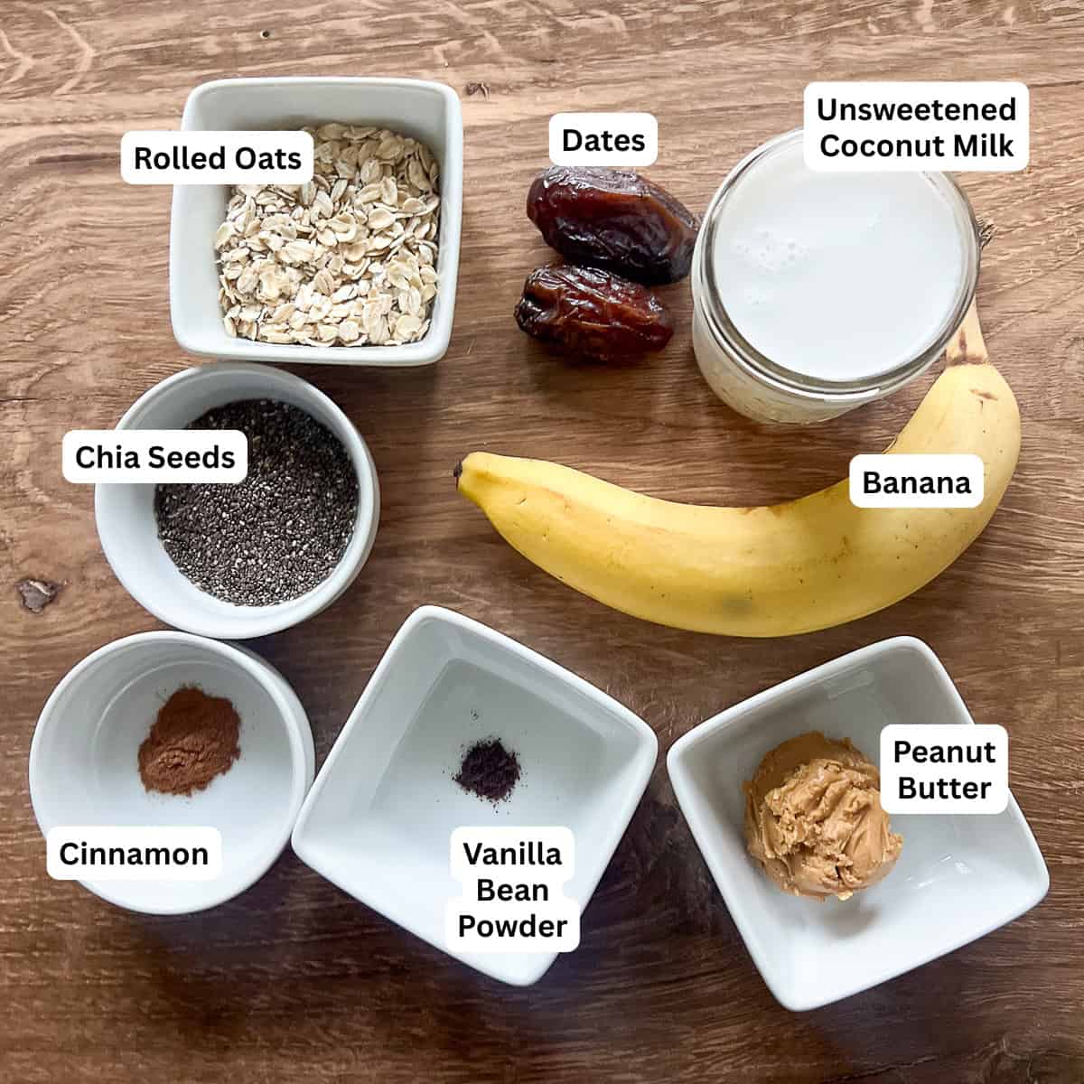 Smoothie ingredients: rolled oats, chia seeds, dates, banana, coconut milk, peanut butter, vanilla bean powder, cinnamon, and pitted dates.